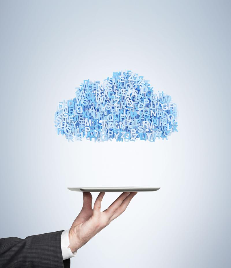 A hand holding a cloud of online tools